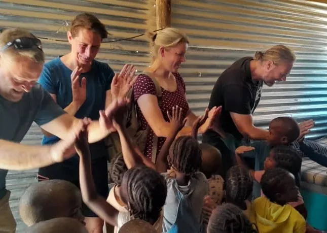 Whipps Wilderness guests and children sharing a lively community visit in the Sorris Sorris Conservancy.